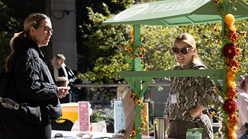 Student checking out a vendor at Sustainability Awareness Week