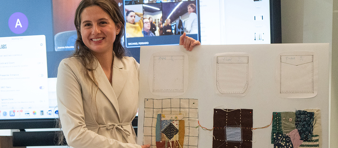 A student presenting winning design for RE.Uniqulo studios