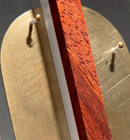 Heather Kosch - Harmonic Collection - Brass plate, Plexiglass, African padauk wood, brass screws, and leather cording.<br />
Heather Kosch - Harmonic Collection - Brass plate, Plexiglass, African padauk wood, brass screws, and leather cording.<br />