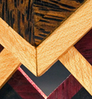 Heather Kosch - Harmonic Collection - Black-palm, ebony, purple-heart, and satin woods; brass findings; and leather cording.<br />
Heather Kosch - Harmonic Collection - Black-palm, ebony, purple-heart, and satin woods; brass findings; and leather cording.<br />