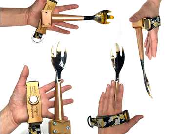 Magnadapt, a handheld swivel system for utensils and tools by the Adaptive Design Association.