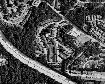 Bird's eye view of a highway and neighborhood