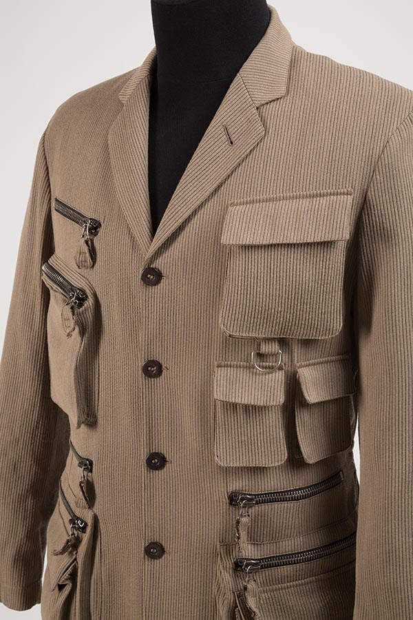 brown jacket with different styles of pockets and zippers going down the left and right front