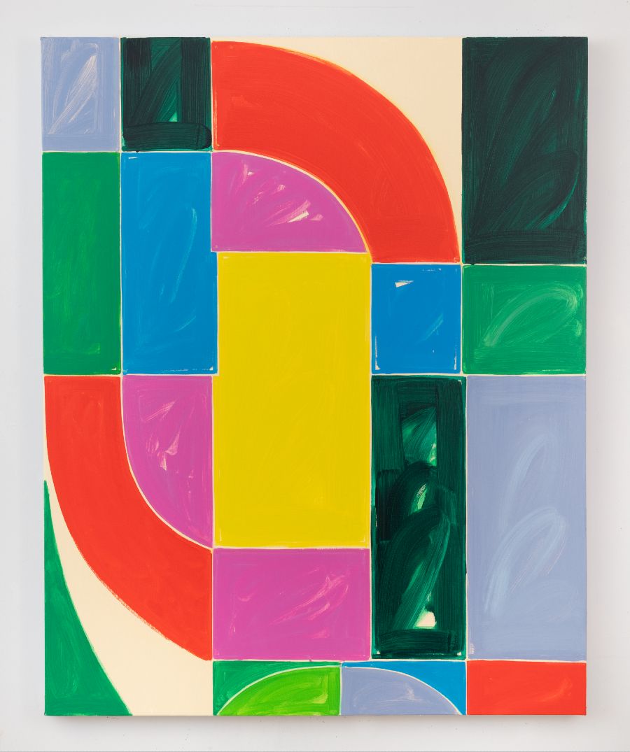bright multicolored geometric shapes in shades of green, red, blue, magenta, violet, and cream, arranged in a pattern reminiscent of a stained glass; thin cream color lines separate the shapes underscoring the effect.