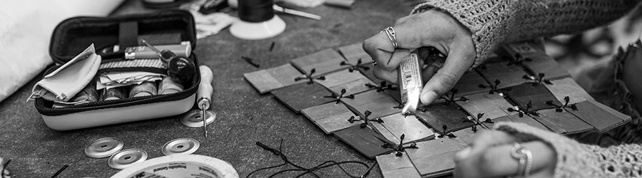 student working on assembling garment