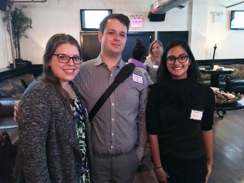 Three FBM alumni at Ross stores networking event.