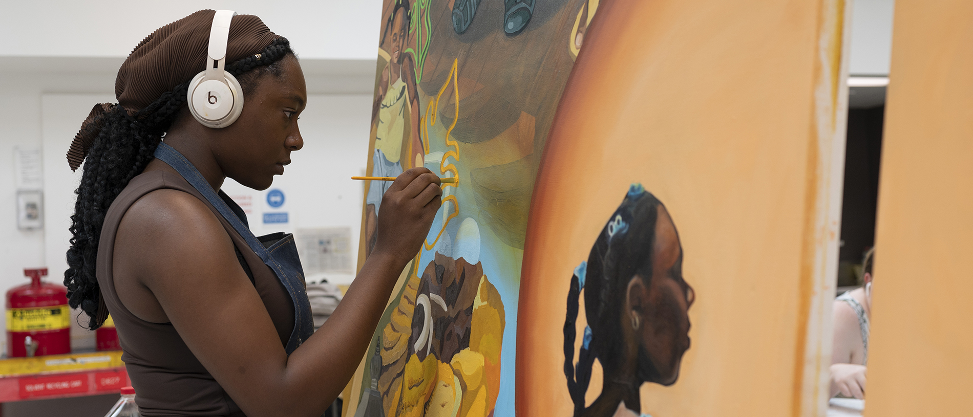 FIT student painting in Fine Arts program