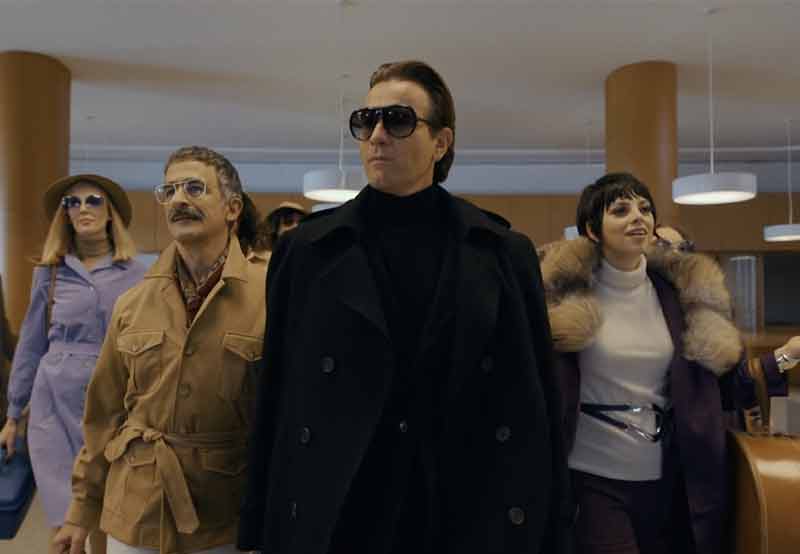 Video still from Halsten walking with his entourage