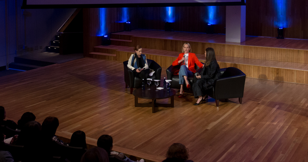 conference session with participants sitting on stage