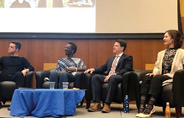 panelists sitting on stage