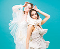 two models wearing white dresses