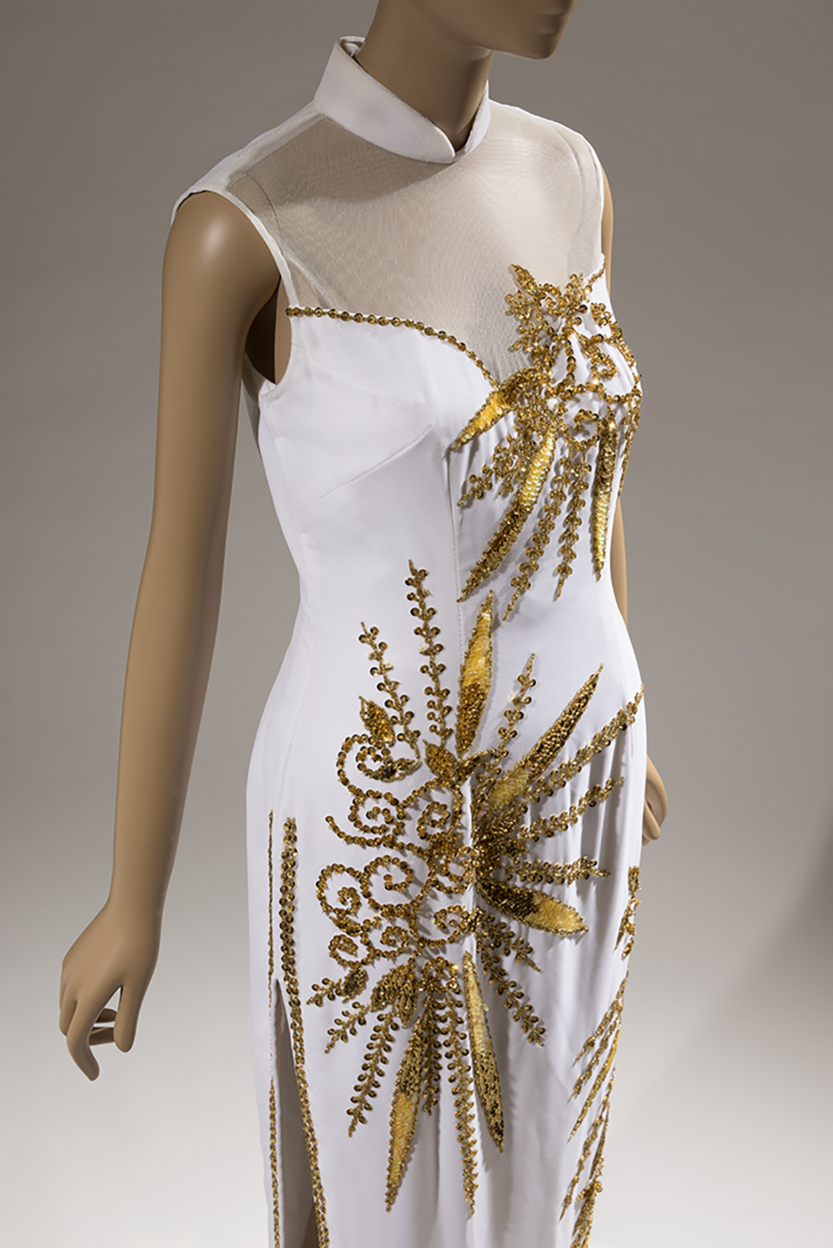 white dress with chinese collar and golden embellishments in floral pattern