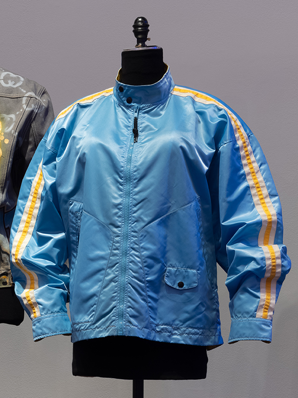 Light blue slicker with yellow racing stripe down outer sleeve