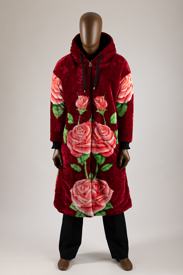 Manniquin in a plush blanket coat with hood and a rose print on front